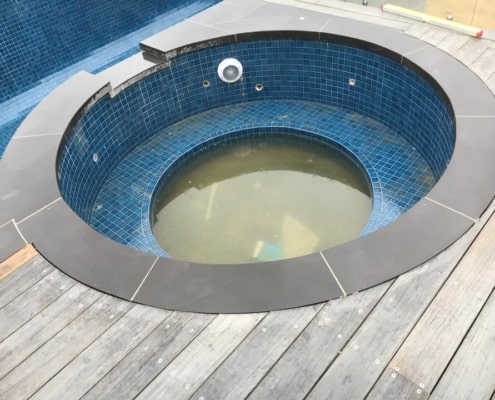 in house custom bluestone curved coping for spa